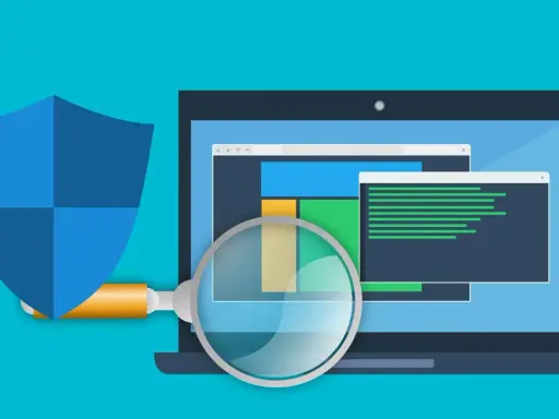 Bouclier bleu protégeant un ordinateur portable analysé par une loupe. Illustration sur la façon de se débarrasser du ransomware.