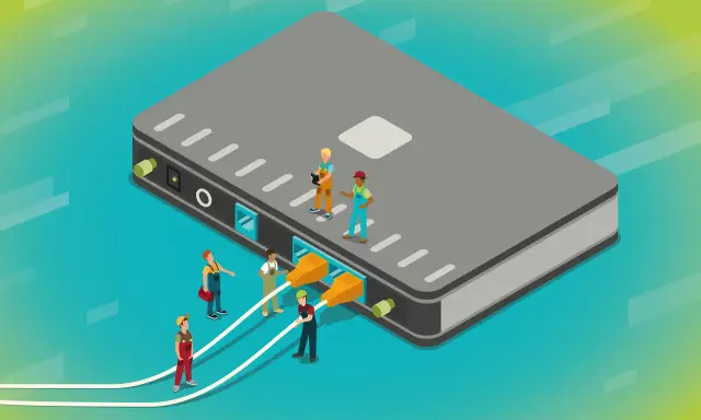 Des ouvriers connectent des câbles à un grand boîtier gris, illustrant a quoi sert un switch : relier plusieurs appareils pour un réseau.