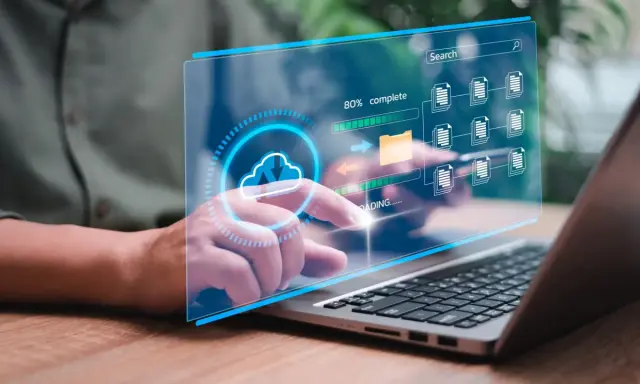 Interface numérique montrant des icônes de documents et un dossier, avec une barre de progression. Un doigt interagit avec l'écran, illustrant des solutions de dématérialisation.